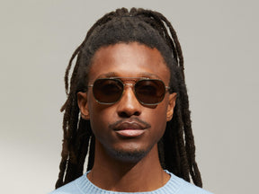 Model is wearing The MIZER SUN in size 54 in Dark Green with G-15 Tinted Lenses