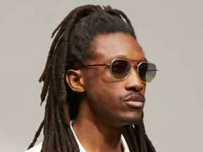 Model is wearing The MIZER SUN in size 54 in Flesh-Tortoise with Forest Wood Tinted Lenses