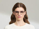 Model is wearing The MOMZA SUN in size 49 in Light Grey with American Grey Fade Tinted Lenses