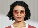 Model is wearing The MOYEL SUN in Rose in size 44 with New York Rose Tinted Lenses