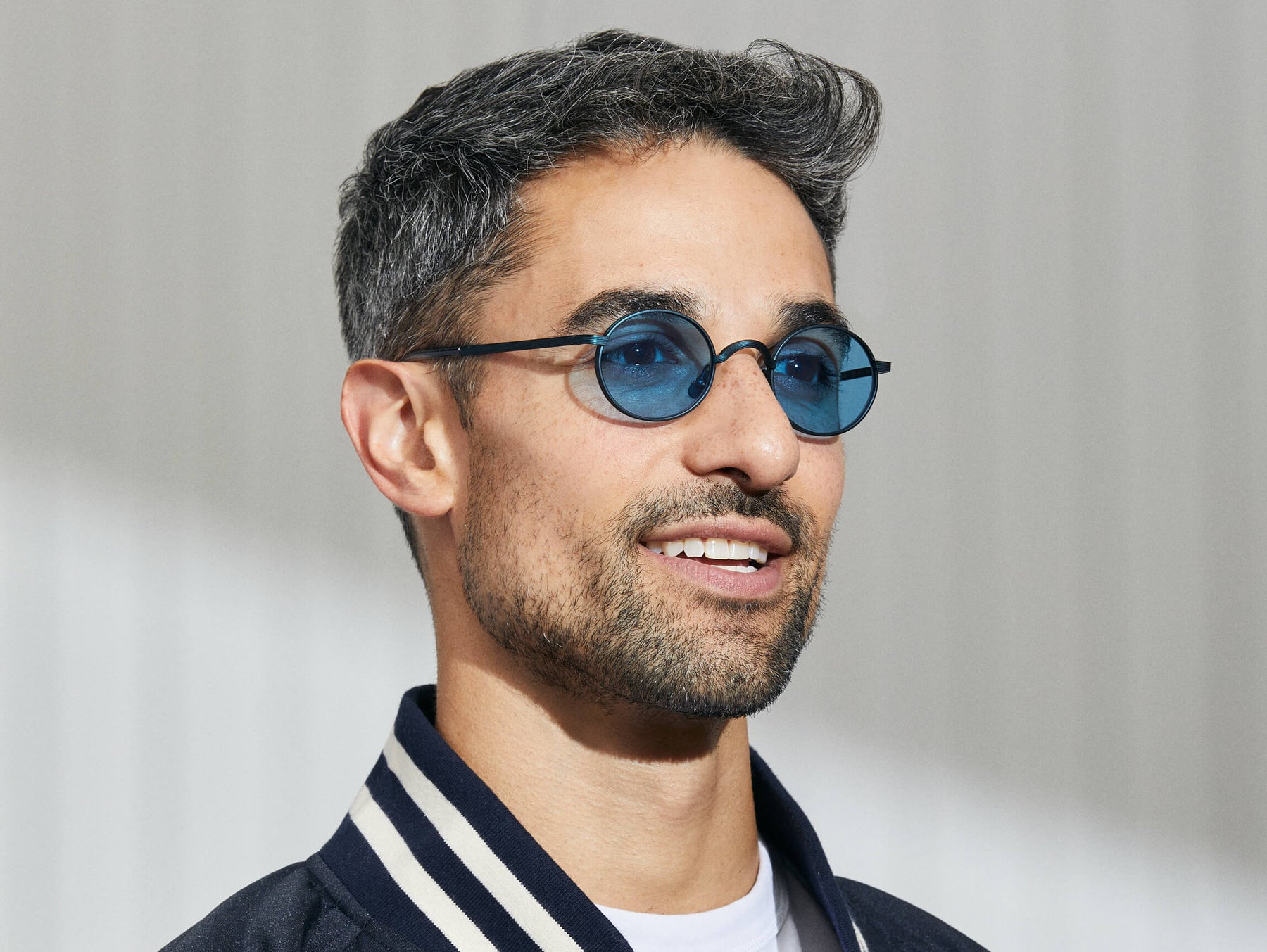 Model is wearing The MOYEL SUN in Navy in size 44 with Celebrity Blue Tinted Lenses