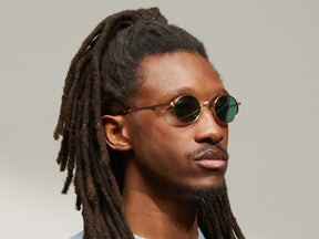 Model is wearing The MOYEL SUN in Gold in size 44 with G-15 Tinted Lenses
