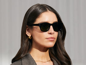 Model is wearing The NEBB SUN in Black in size 51 with G-15 Glass Lenses