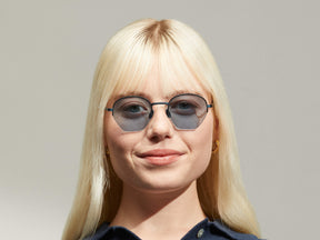 Model is wearing The PLOTZ SUN in size 49 in Navy with Blue Tinted Lenses