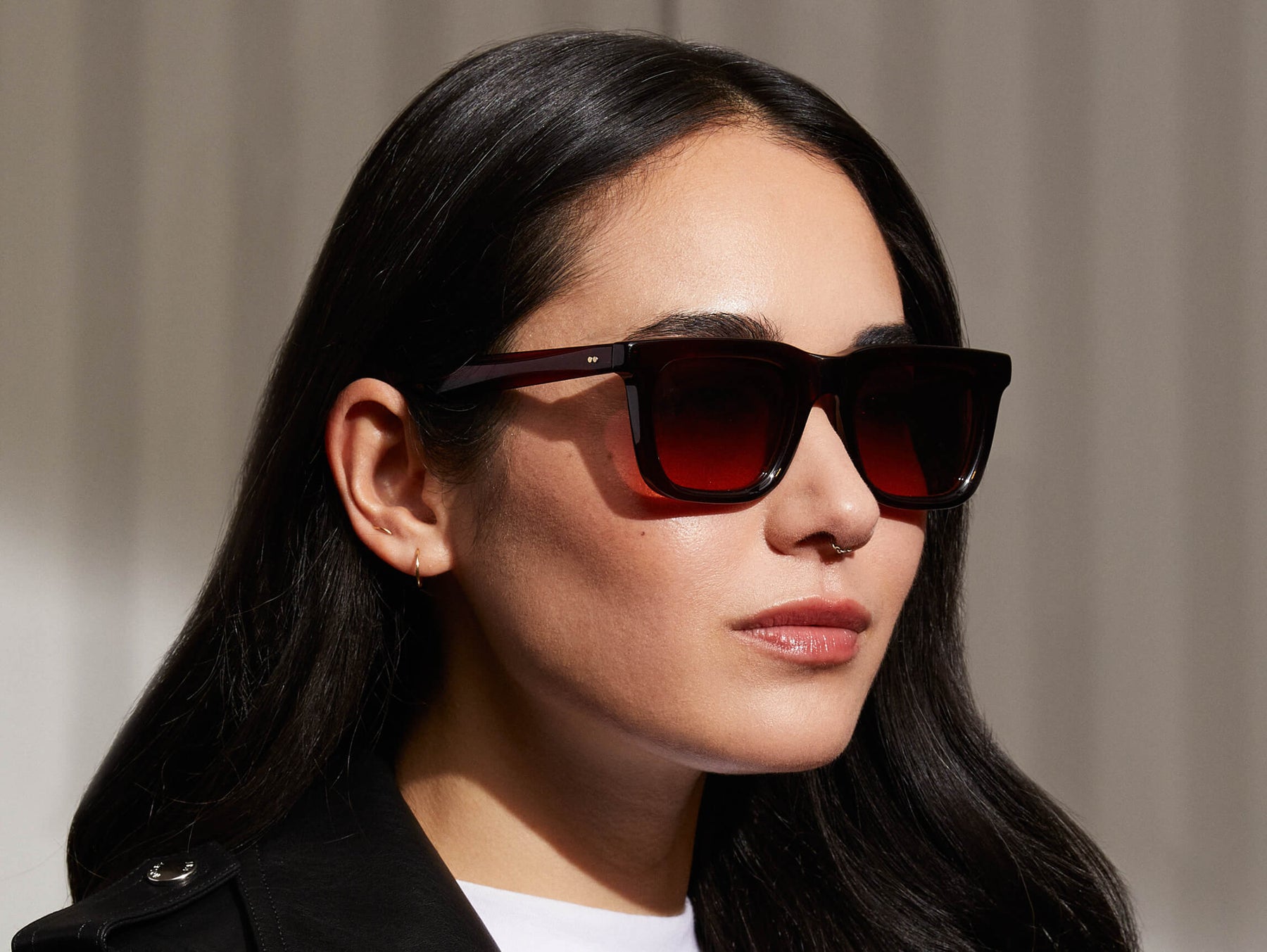 Model is wearing The RIZIK SUN in Burgundy in size 49 with Cabernet Tinted Lenses