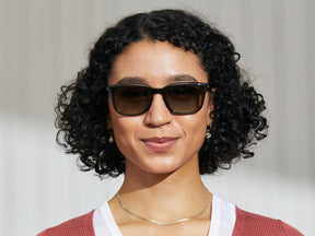 Model is wearing The SHIDDOCK SUN in Dark Green in size 52 with Forest Wood Tinted Lenses