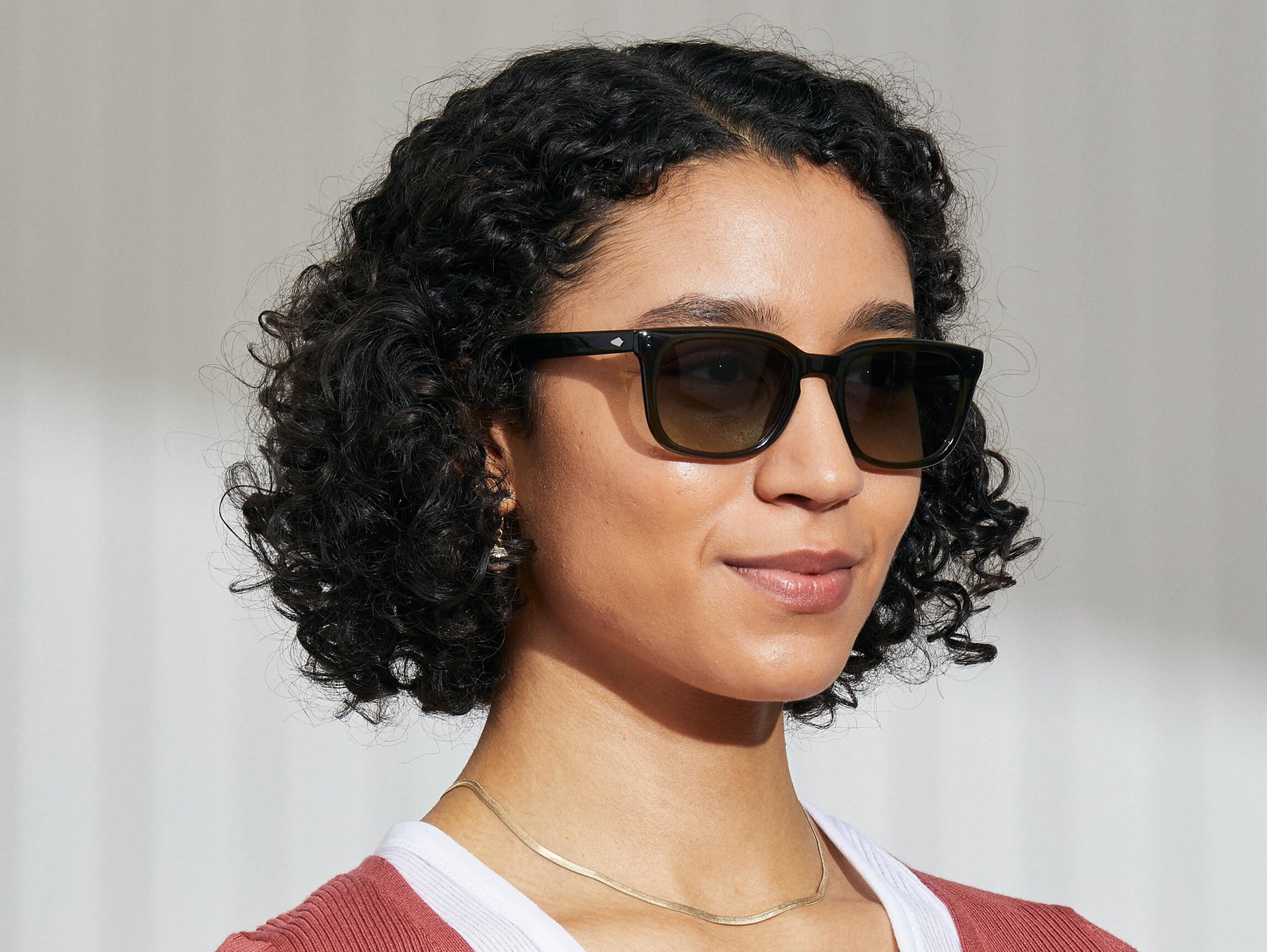 Model is wearing The SHIDDOCK SUN in Dark Green in size 52 with Forest Wood Tinted Lenses