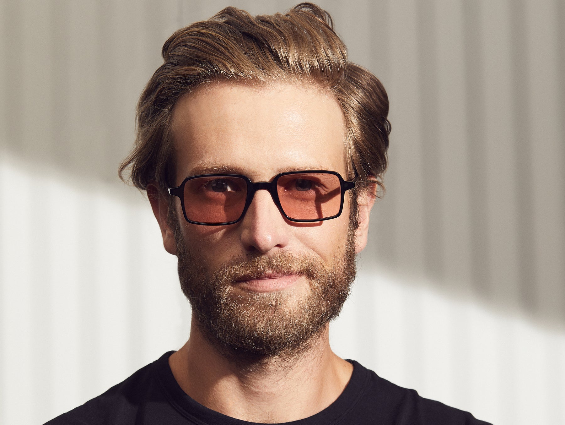 Model is wearing The SHINDIG in Black in size 50 with New York Rose Tinted Lenses