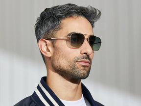 Model is wearing The SHTARKER in size 54 in Gold with Forest Wood Tinted Lenses
