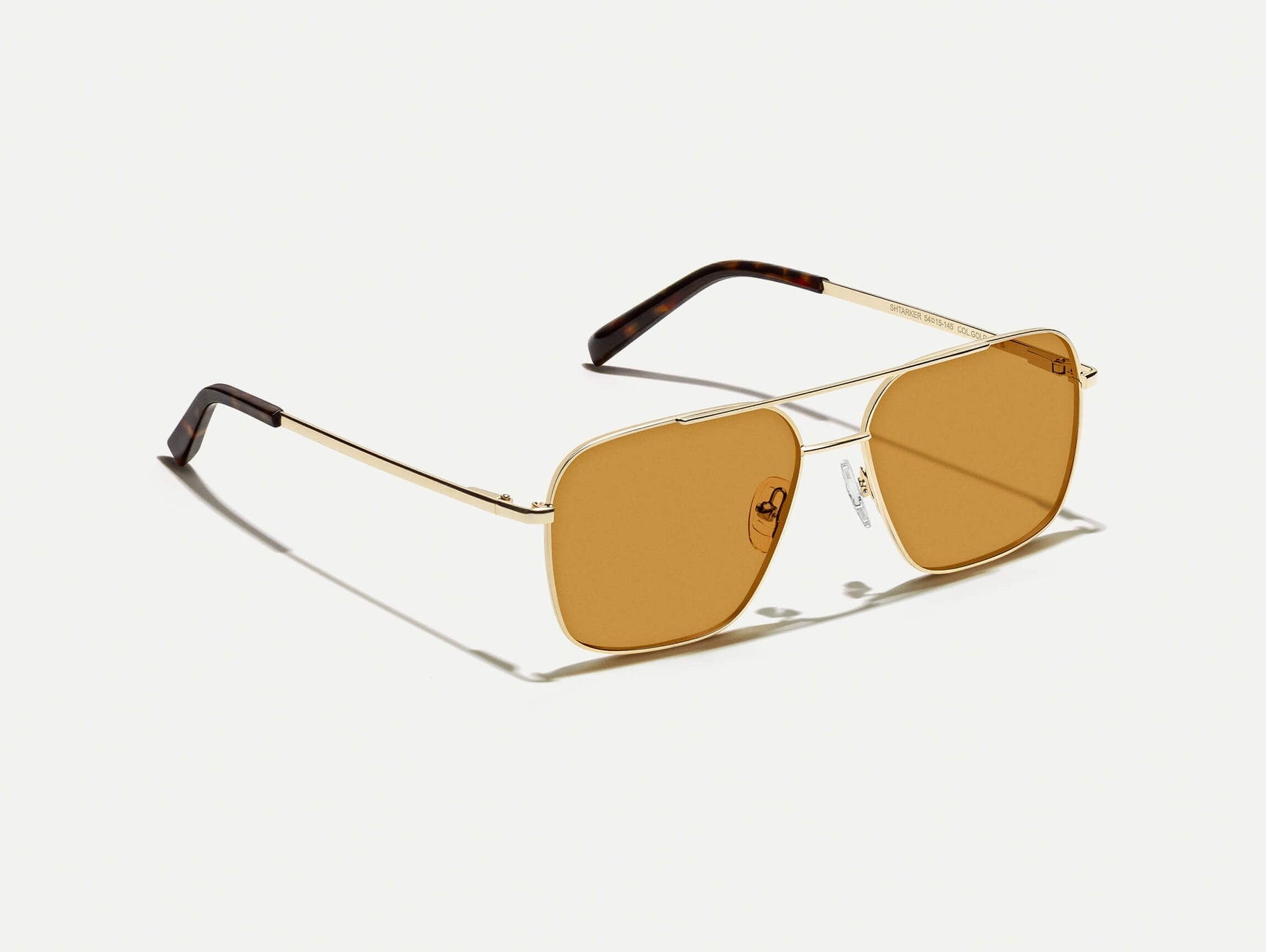 The SHTARKER in Gold with Amber Tinted Lenses