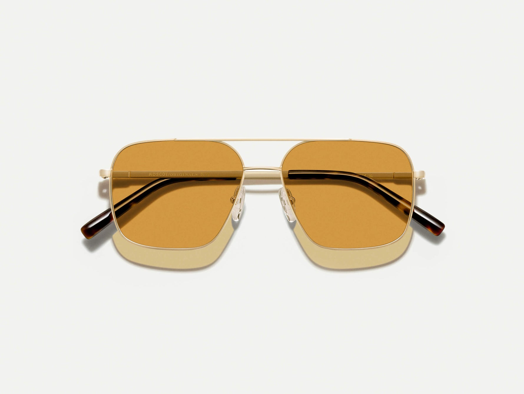 The SHTARKER in Gold with Amber Tinted Lenses