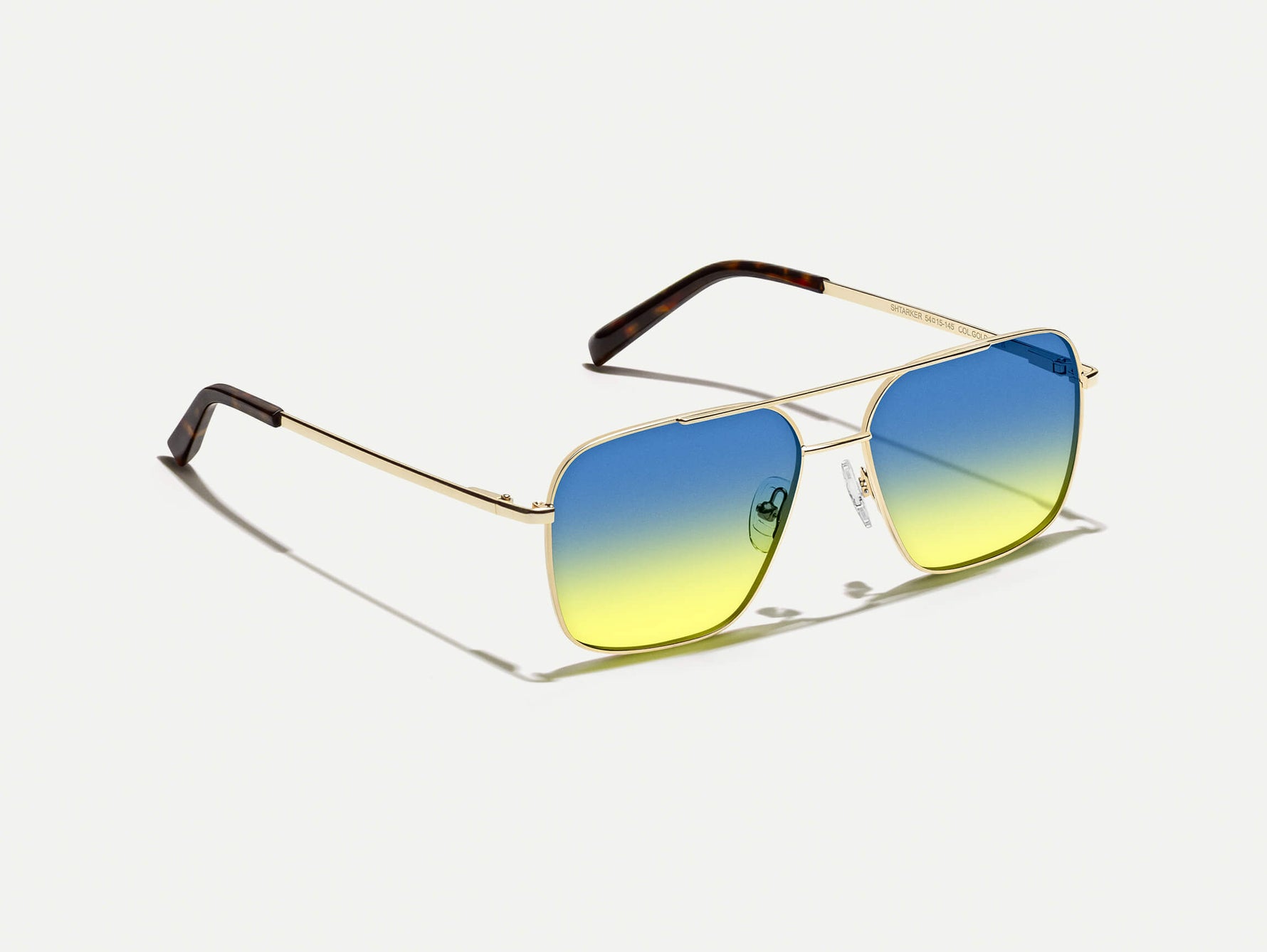 The SHTARKER in Gold with Aqua Sunrise Tinted Lenses