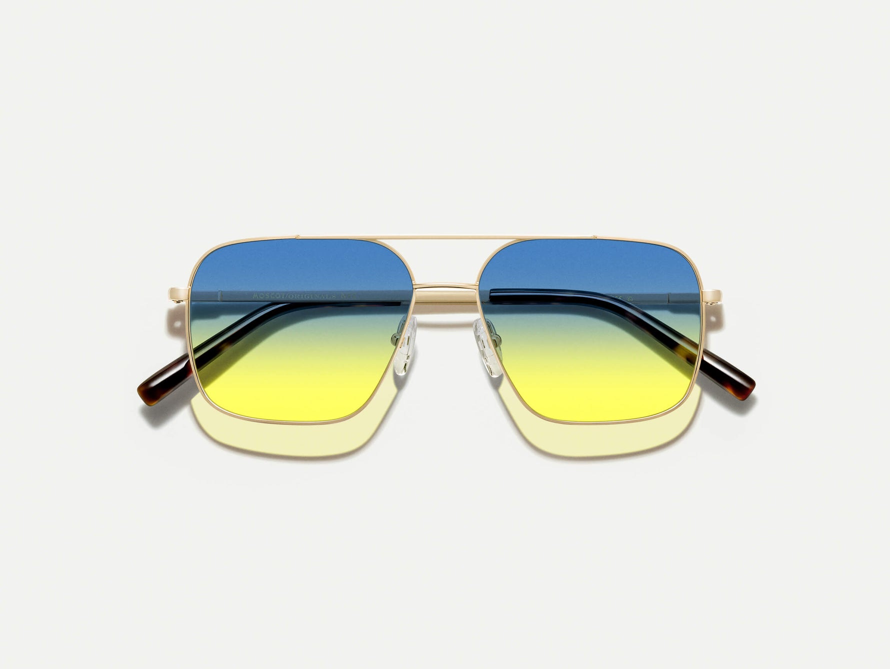 The SHTARKER in Gold with Aqua Sunrise Tinted Lenses