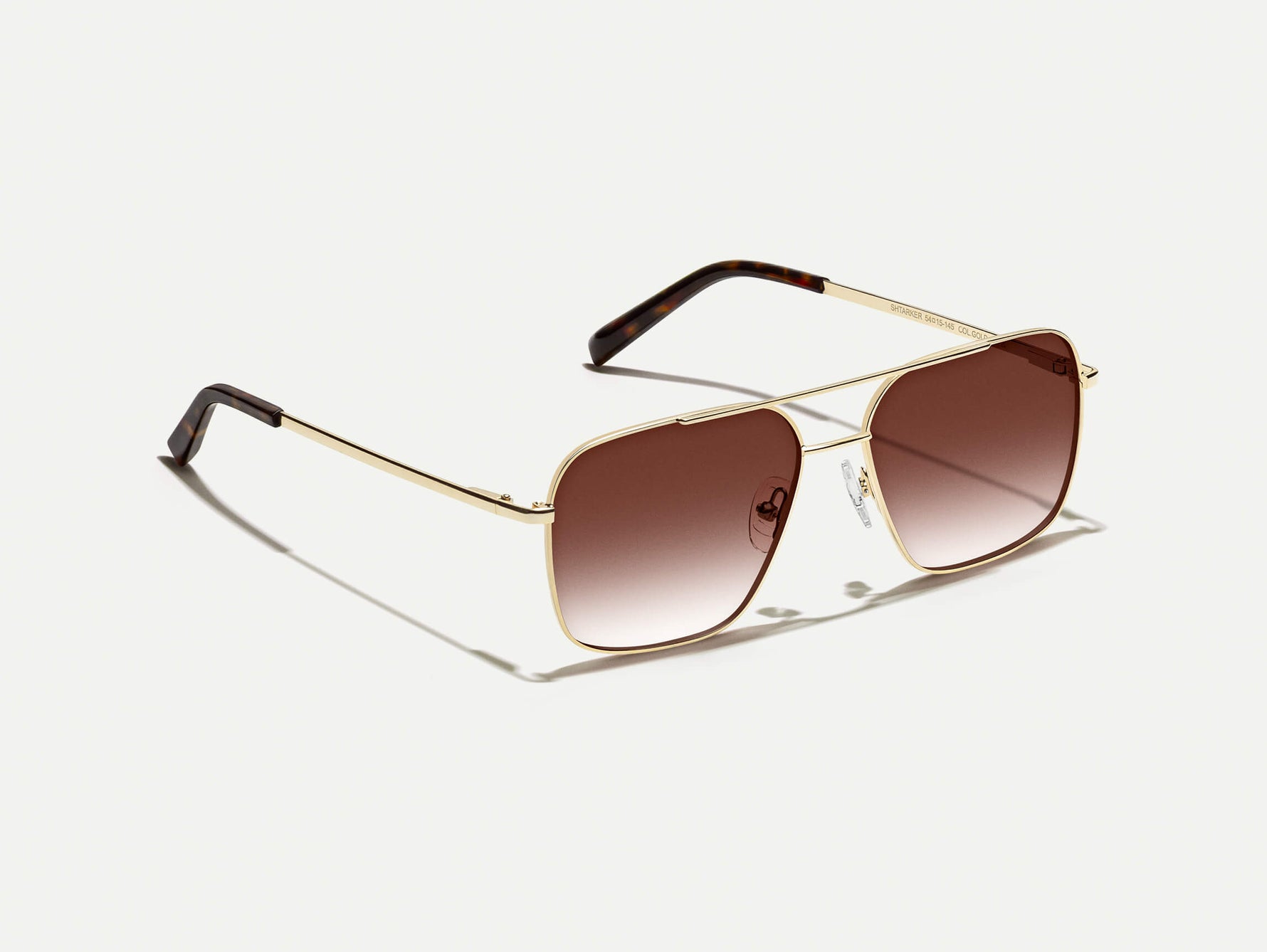 The SHTARKER in Gold with Root Beer Fade Tinted Lenses
