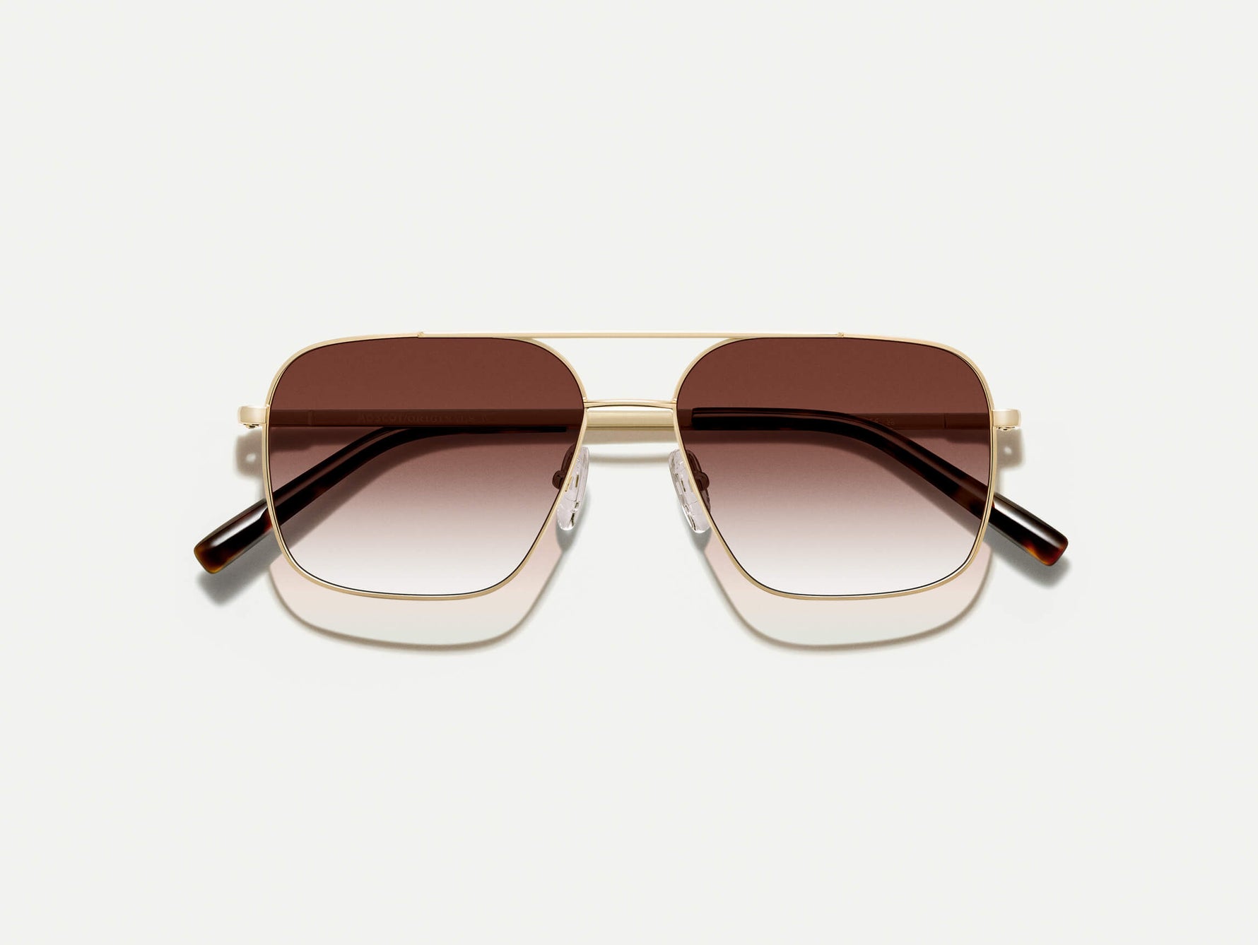 The SHTARKER in Gold with Root Beer Fade Tinted Lenses