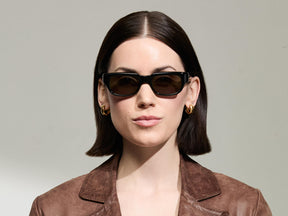 Model is wearing The SHTUP SUN in size 51 in Black with G-15 Tinted Lenses