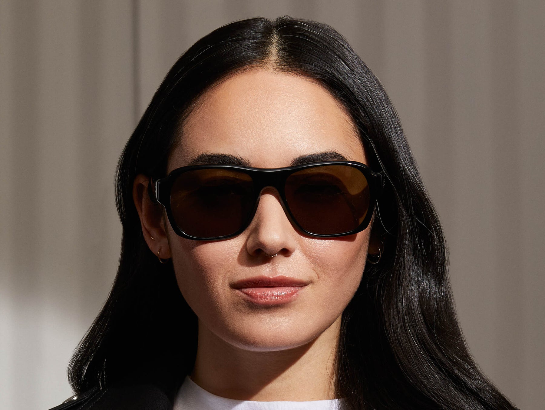 Model is wearing The SHVITZ SUN in Black in size 57 with CR-39 Green Lenses