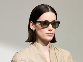 Model is wearing The SPILKES SUN in size 48 in Pine with Forest Wood Tinted Lenses 