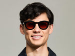 Model is wearing The TELENA in Black in size 47 with Cabernet Tinted Lenses