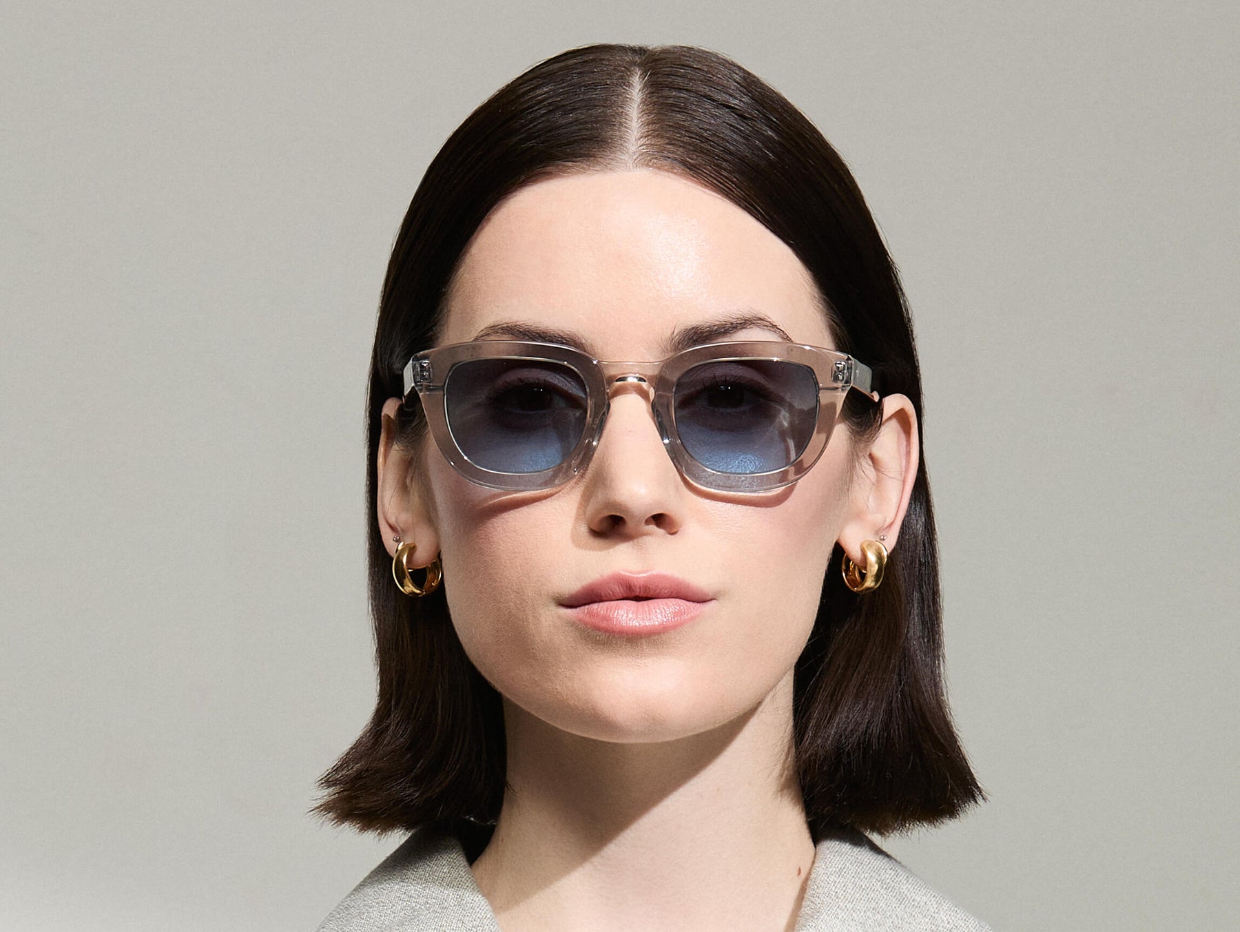 Model is wearing The TELENA in Grey/Light Grey in size 47 with Denim Blue Tinted Lenses