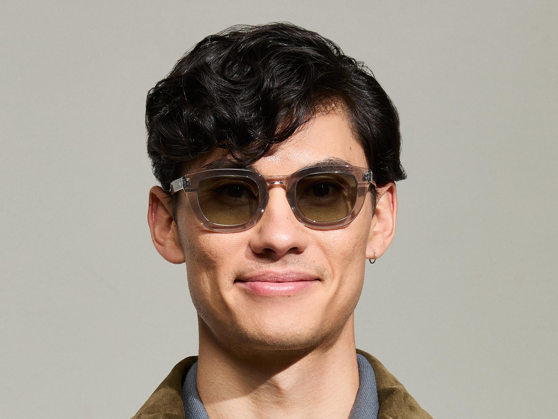 Model is wearing The TELENA in Grey/Light Grey in size 47 with Forest Wood Tinted Lenses