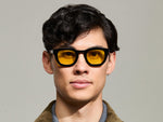Model is wearing The TELENA in Black in size 47 with Mellow Yellow Tinted Lenses