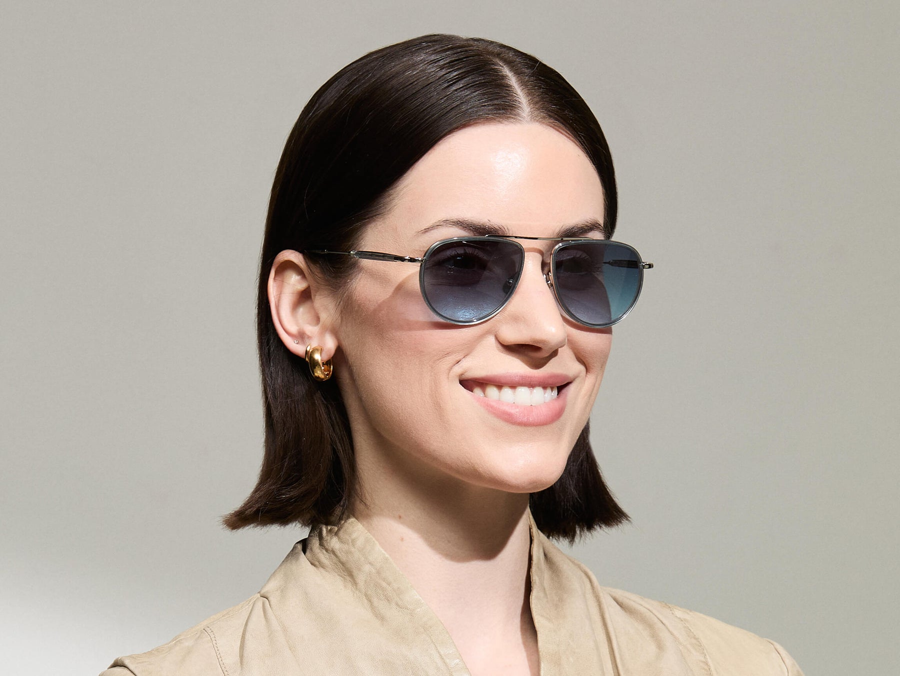 Model is wearing The TRAIF SUN in size 52 in Light Blue with Denim Blue Tinted Lenses