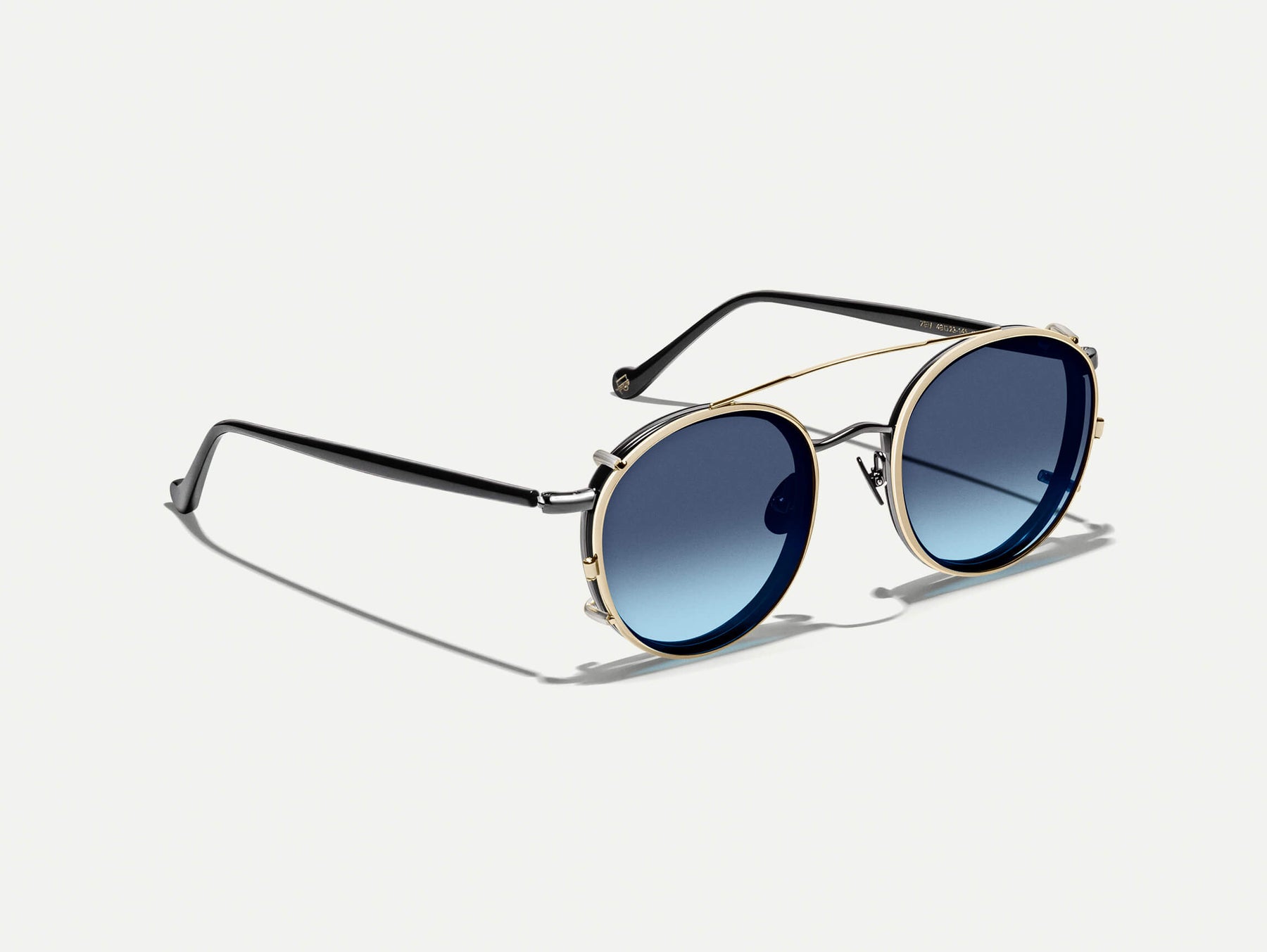 The ZEV CLIP  in Gold with Denim Blue Tinted Lenses