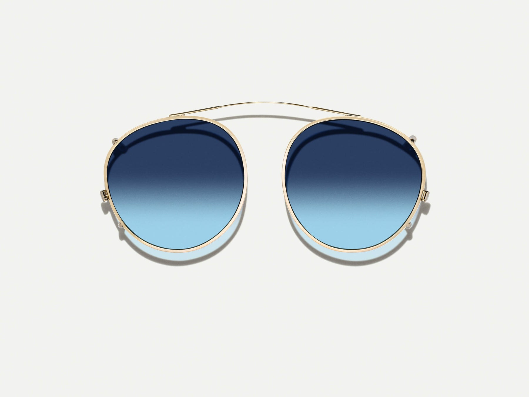 The ZEV CLIP  in Gold with Denim Blue Tinted Lenses