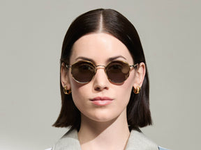 Model is wearing The ZEV SUN in Bamboo in size 49 with G-15 Tinted Lenses