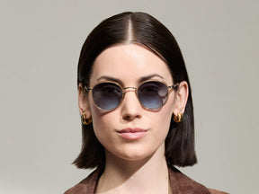 Model is wearing The ZEV SUN in Cinnamon in size 49 with Denim Blue Tinted Lenses
