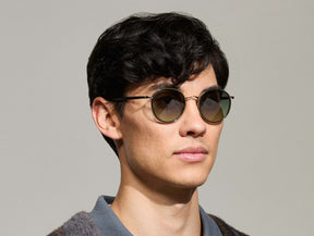 Model is wearing The ZEV SUN in Dark Green in size 49 with Forest Wood Tinted Lenses