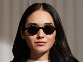 Model is wearing The ZOLMAN CLIP in Gold in size 42 with G-15 Lenses