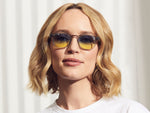 Model is wearing The LEMTOSH in Light Grey in size 46 with Aqua Sunrise Tinted Lenses