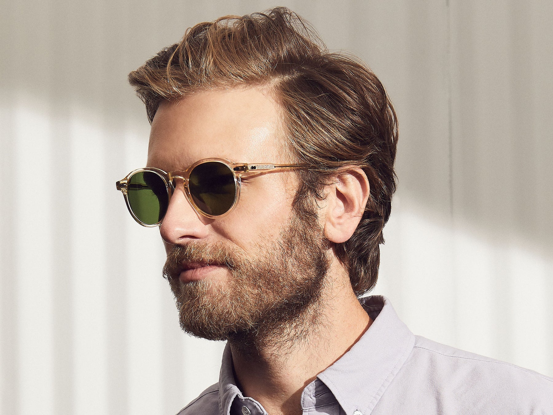 Model is wearing The MILTZEN SUN in Flesh in size 46 with Calibar Green Glass Lenses