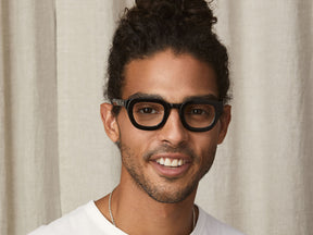 Model is wearing The TELENA in Black in size 41 with Blue Protect Lenses