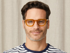 Model is wearing The TELENA in Butterscotch in size 44 with Blue Protect Lenses