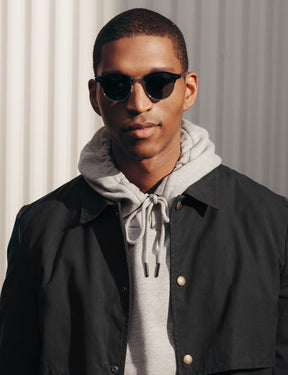 Model is wearing The AIDIM SUN in Black/Silver in size 46 with G-15 Glass Lenses