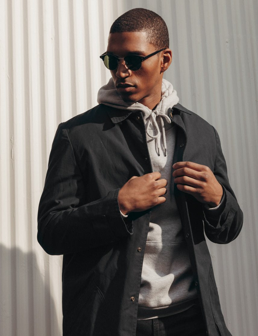 Model is wearing The AIDIM SUN in Black/Silver in size 46 with G-15 Glass Lenses