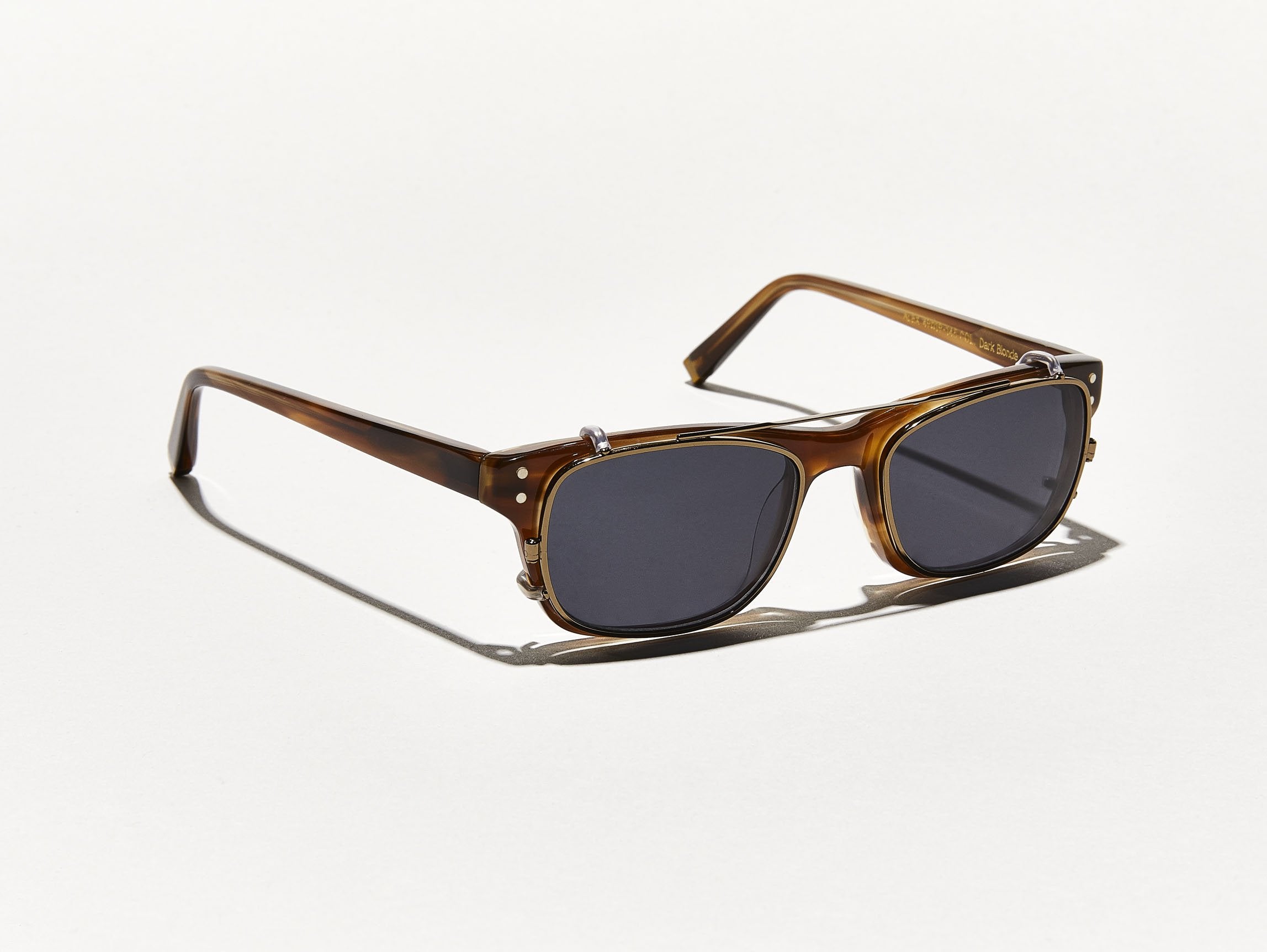 The ALEX CLIP in Brass with Grey Lenses