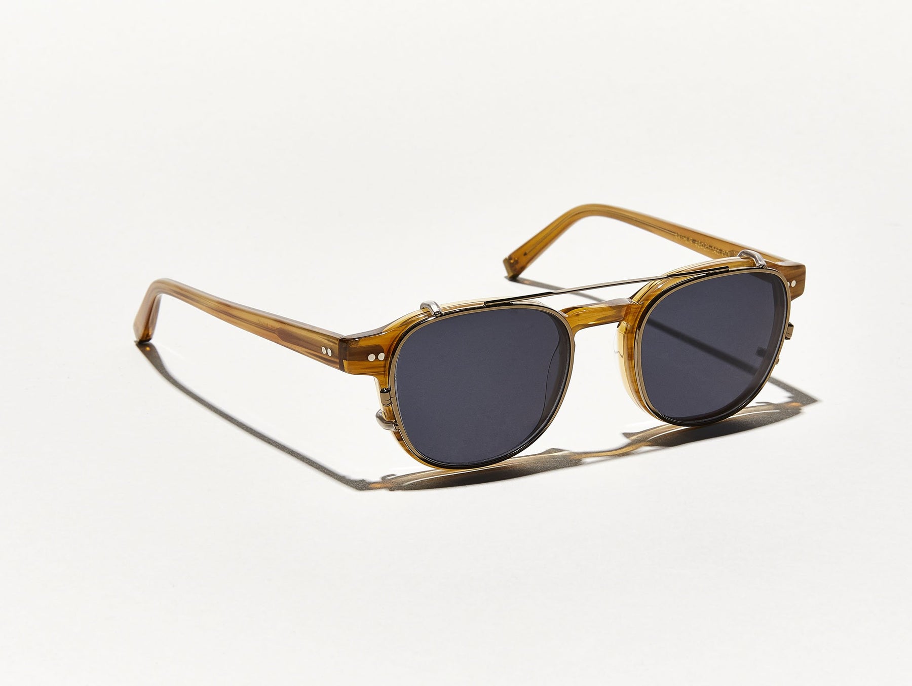 The ARTHUR CLIP in Brass with Grey Lenses
