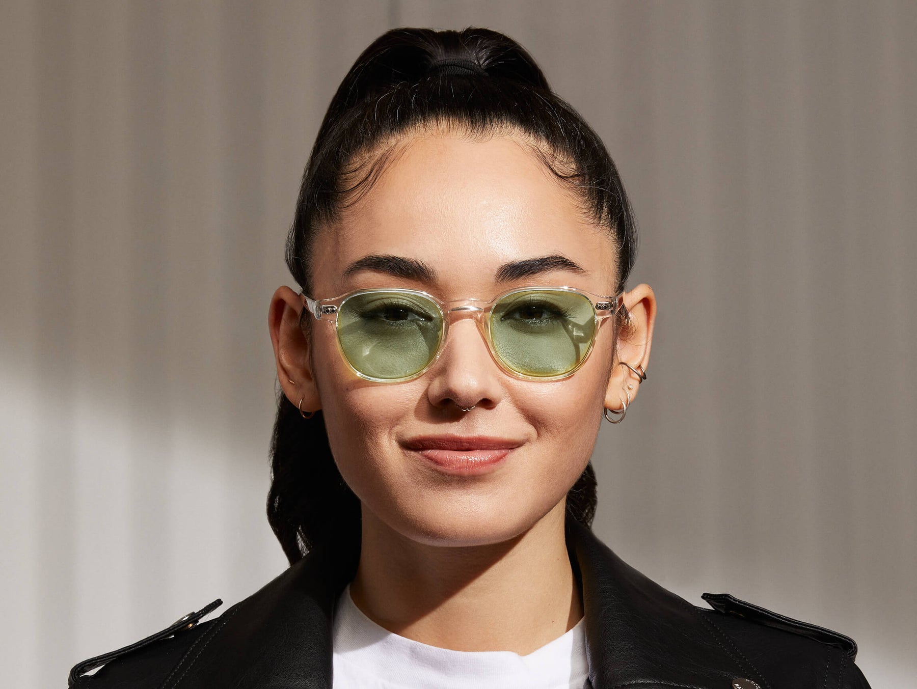 Model is wearing The ARTHUR in Crystal in size 48 with Limelight Tinted Lenses
