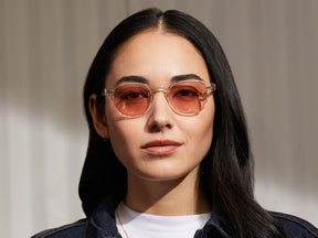 Model is wearing The ARTHUR in Crystal in size 48 with New York Rose Tinted Lenses