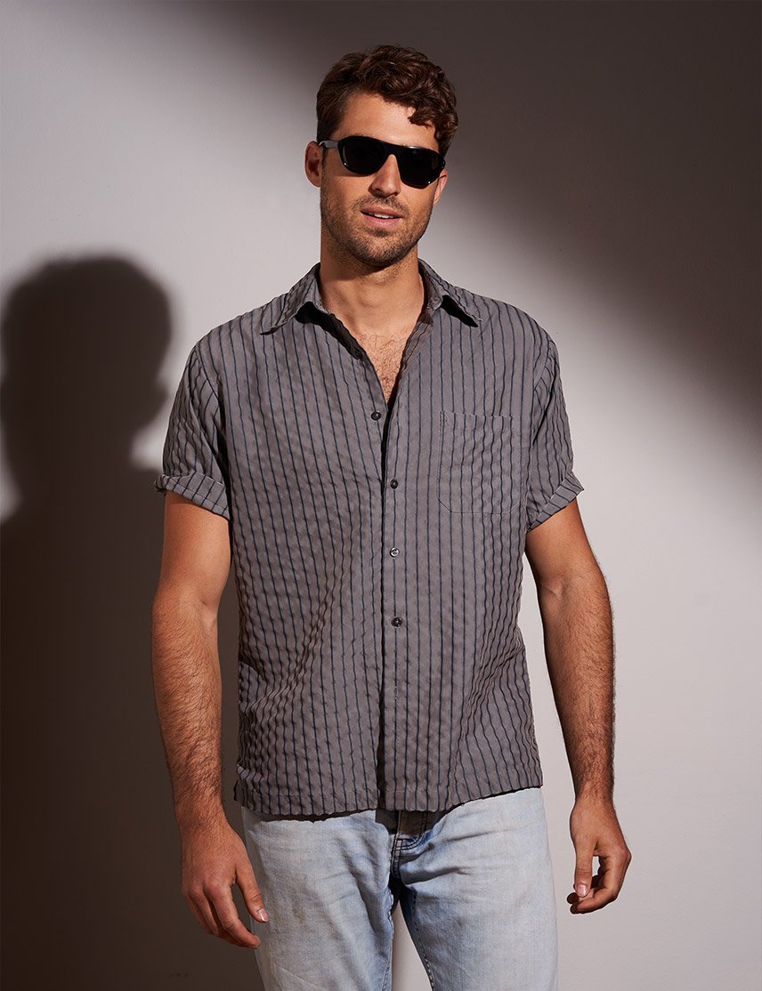Model is wearing The AVRAM SUN in black in size 54 with G-15 Glass Lenses