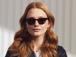 Model is wearing The BALEBUS SUN in Olive Bark in size 47 with Cosmitan Brown Glass Lenses