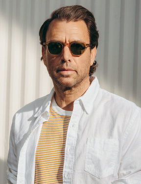 Model is wearing The BILLIK SUN in Cinnamon in size 47 with Calibar Green Glass Lenses