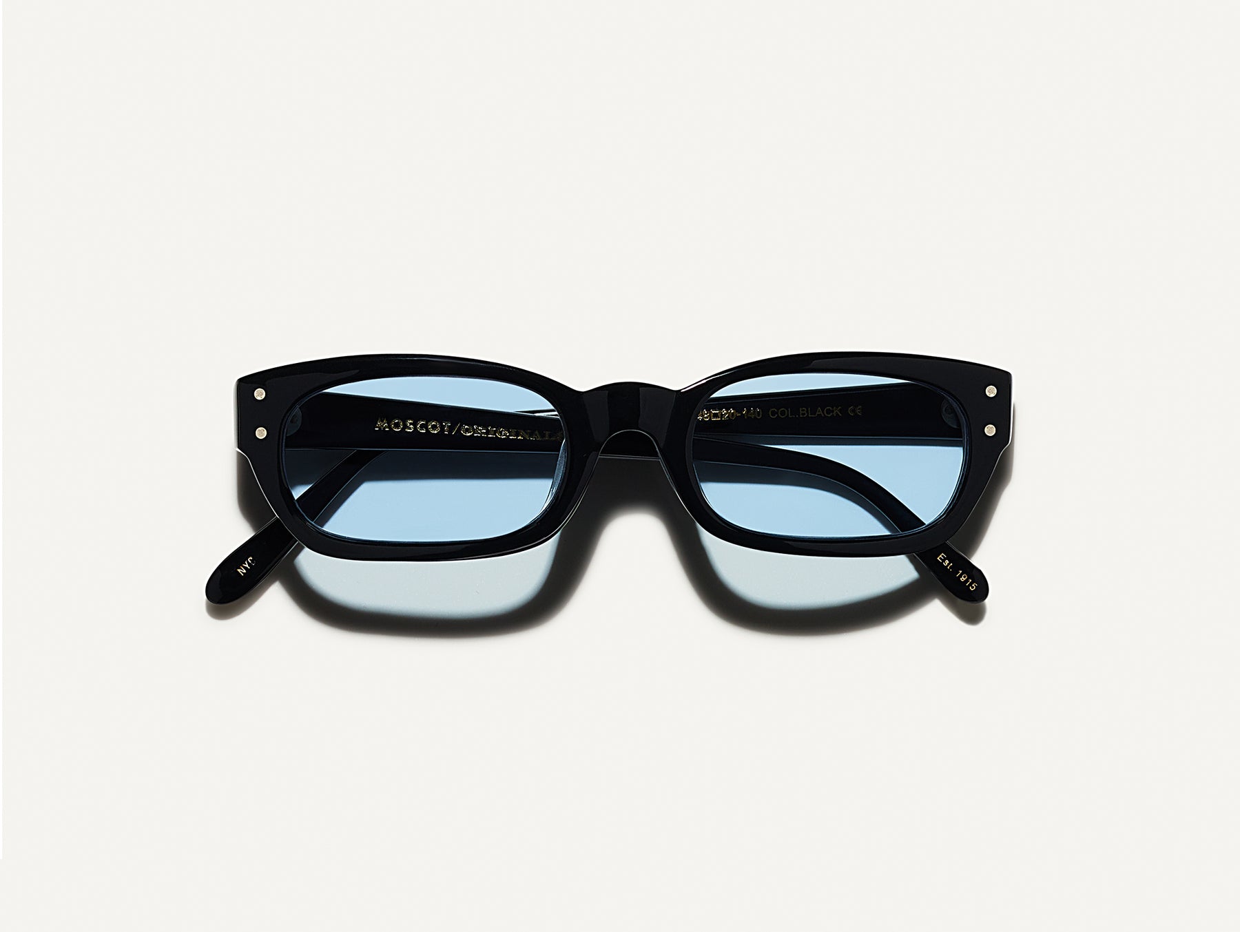 The BISSLE SUN in Black with Bel Air Blue Tinted Lenses