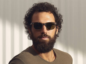 Model is wearing The BOYCHIK SUN in Matte Dark Blonde in size 52 with Calibar Green Glass Lenses