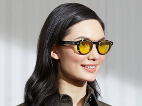 Model is wearing The CLIPTOSH in Gold in size 46 with Mellow Yellow Tinted Lenses