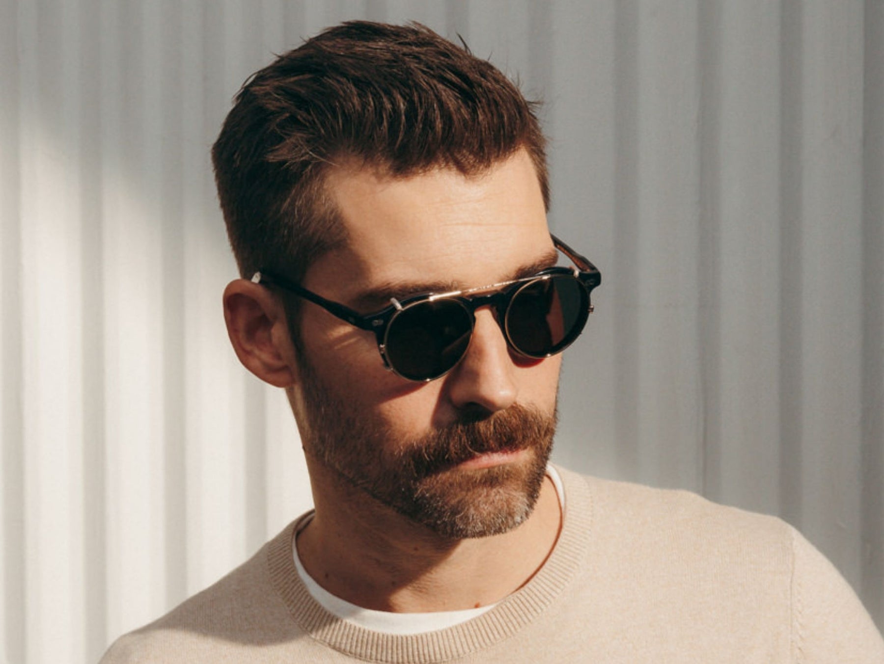 Model is wearing The CLIPZEN in Gold in size 49 with G-15 Lenses